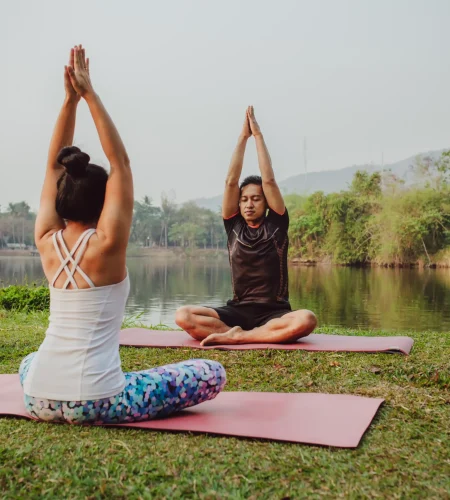 yoga-partners-sitting-with-hands-up-1